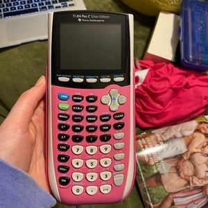 TI-84 graphing calculator with charger